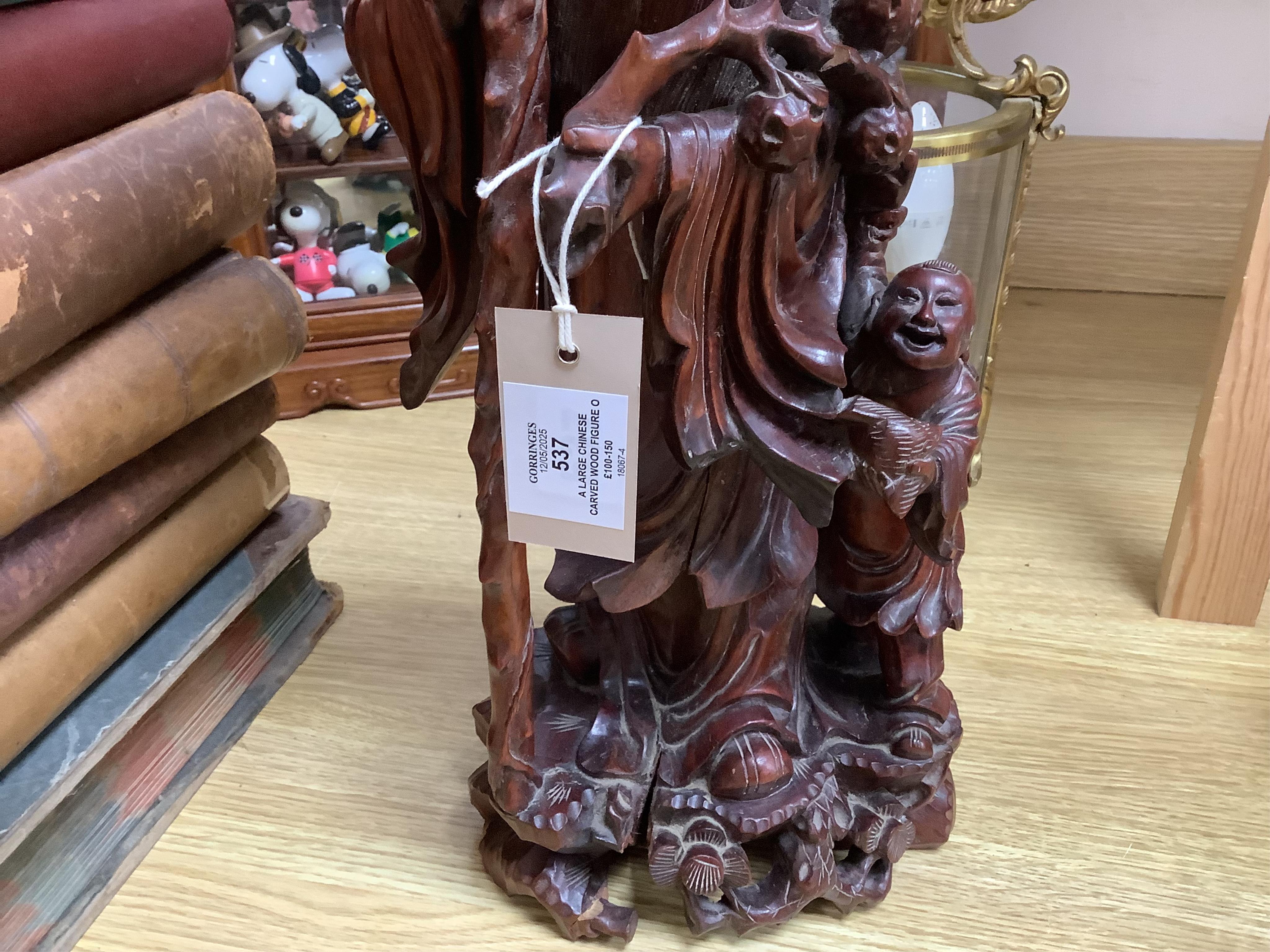 A large Chinese carved wood figure of Shouloau, 51cm high. Condition - some cracks to the wood